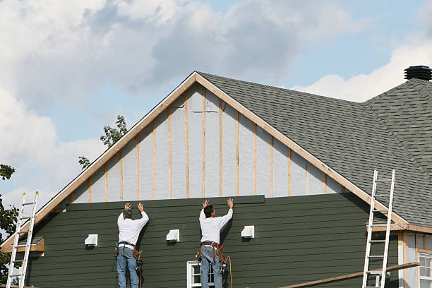 Professional Siding Installation technician working in Florence, OR